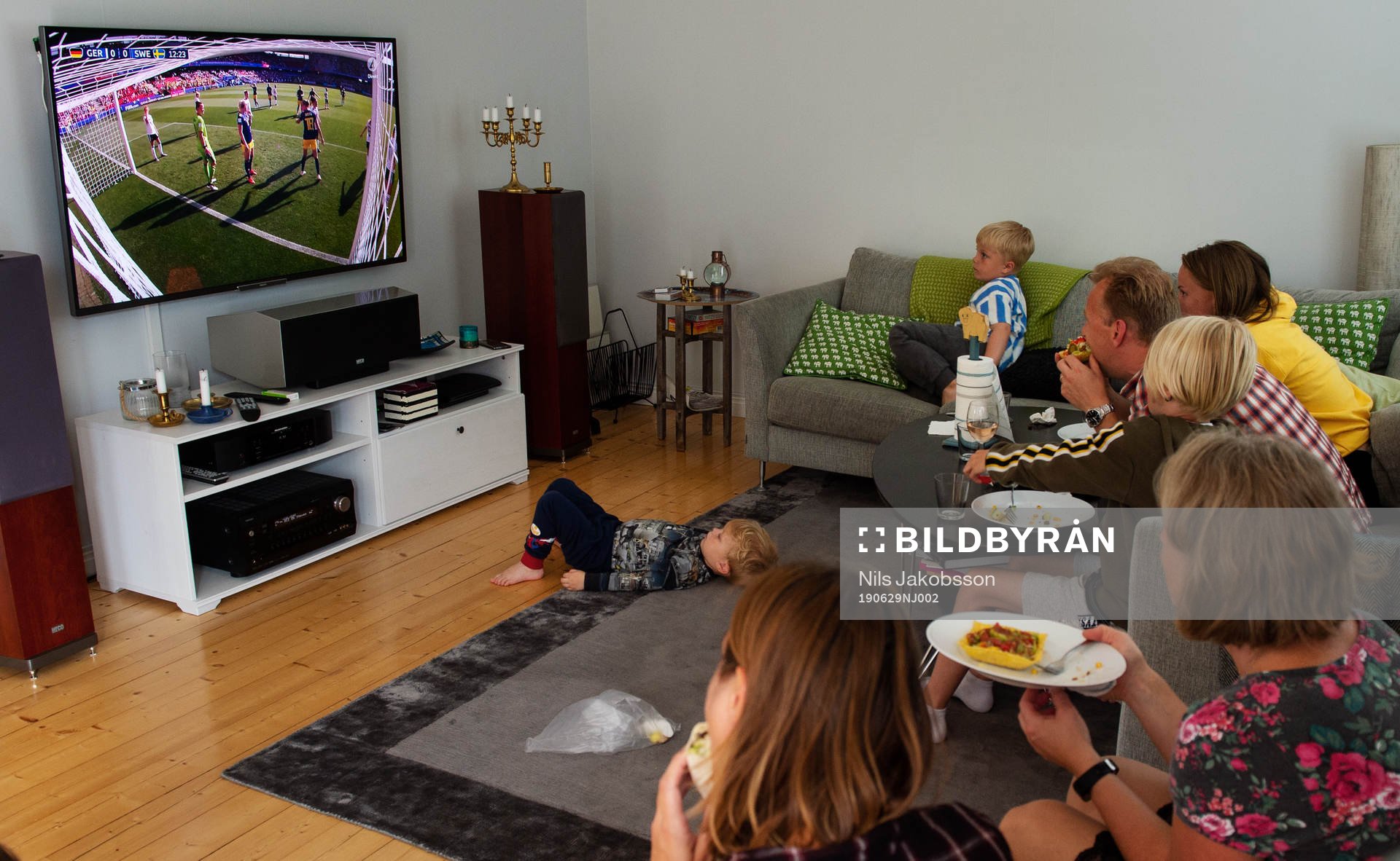 A family is watching the game