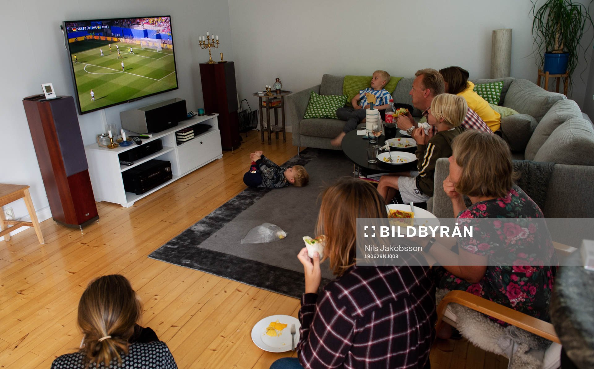 A family is watching the game