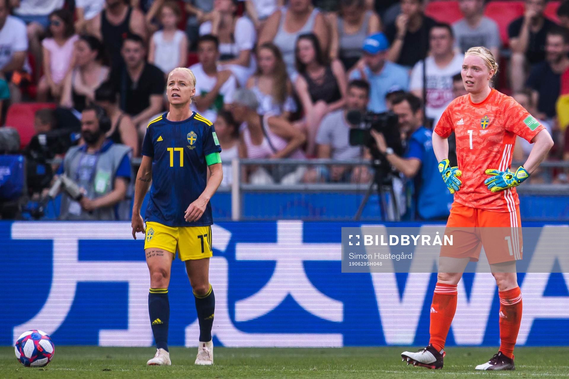 Caroline Seger and goalkeeper Hedvig Lindahl of Sweden look
