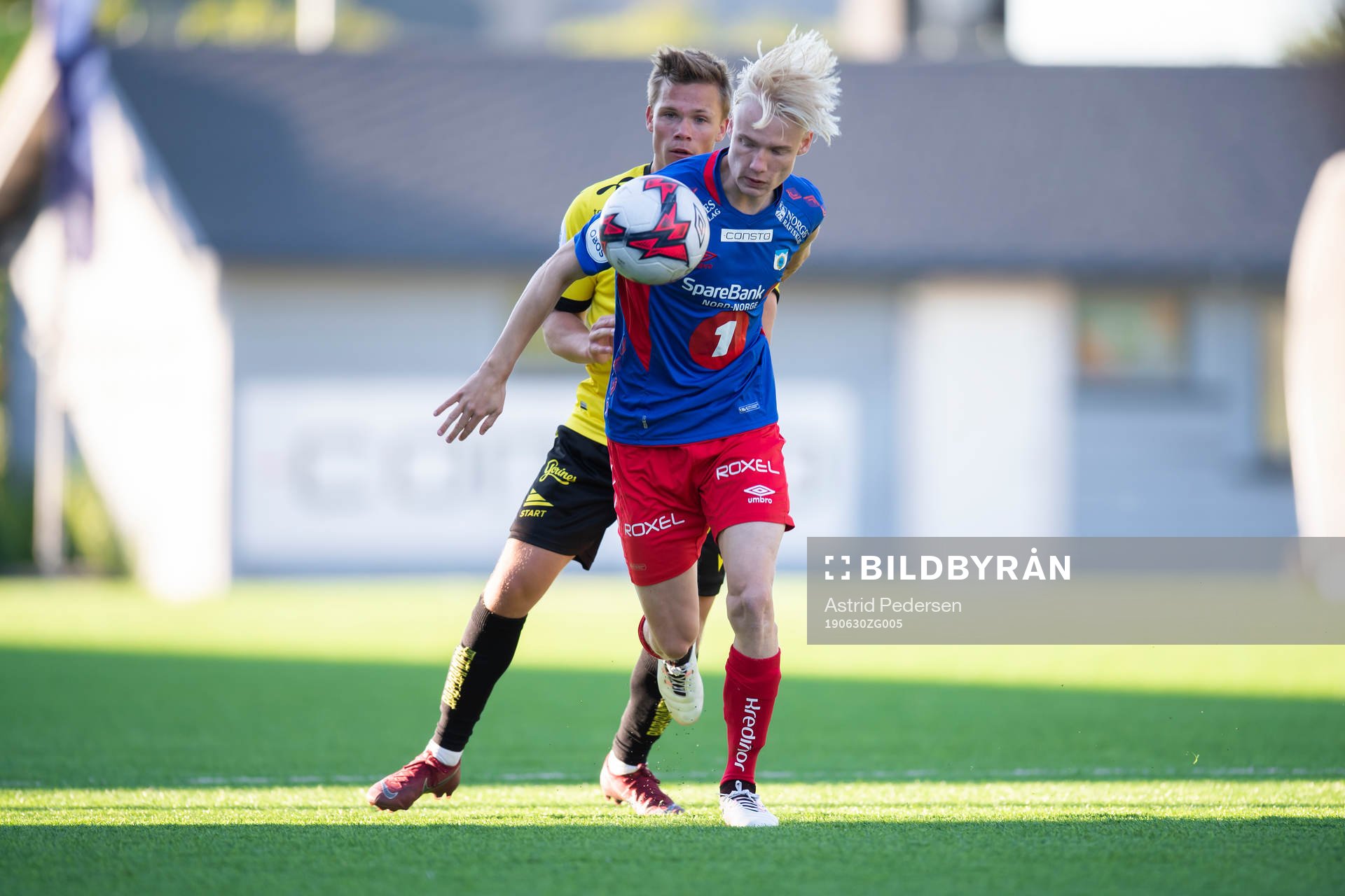 Eirik Wichne of Start and Harald Nilsen Tangen of Tromsdalen during the OBOS-ligaen match between Tromsdalen and Start on June 30, 2019 in Tromsø.