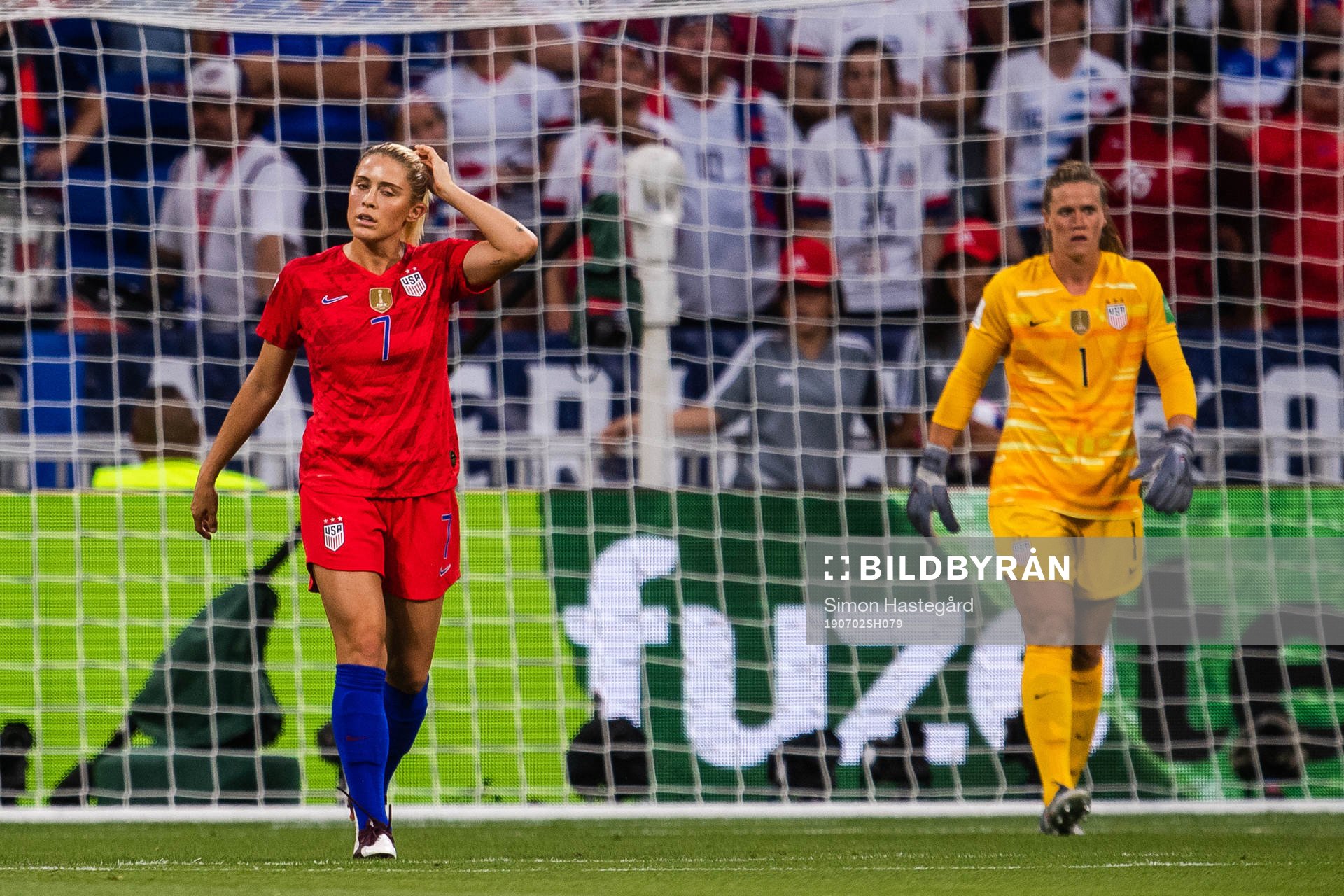 Abigail Dahlkemper and goalkeeper Alyssa Naeher of USA look