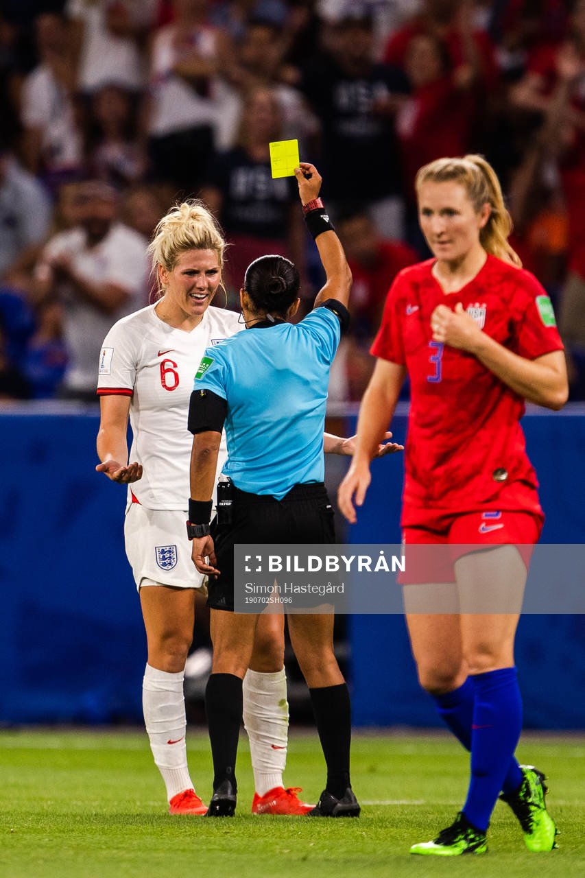 Millie Bright of England receives a yellow card
