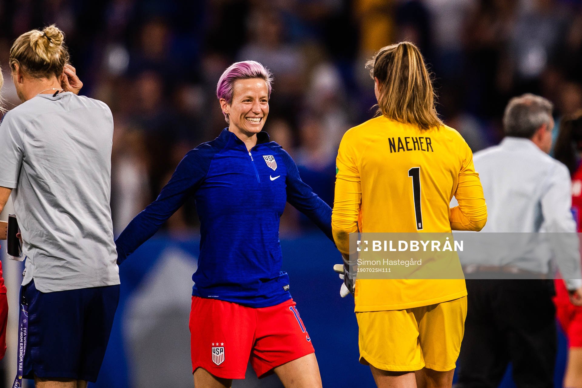 Megan Rapinoe and goalkeeper Alyssa Naeher of USA celebrate