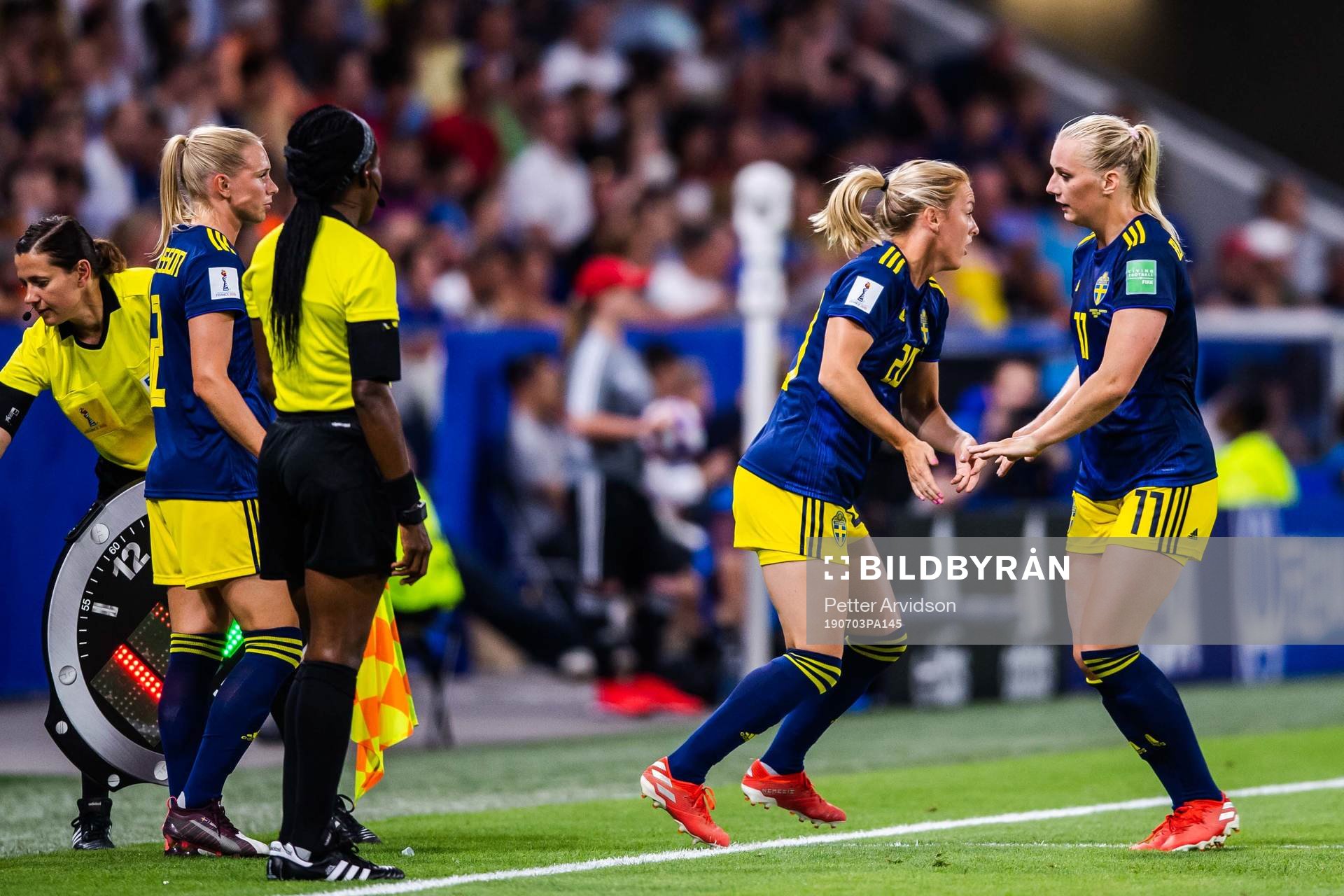 Stina Blackstenius changes with Mimmi Larsson of Sweden