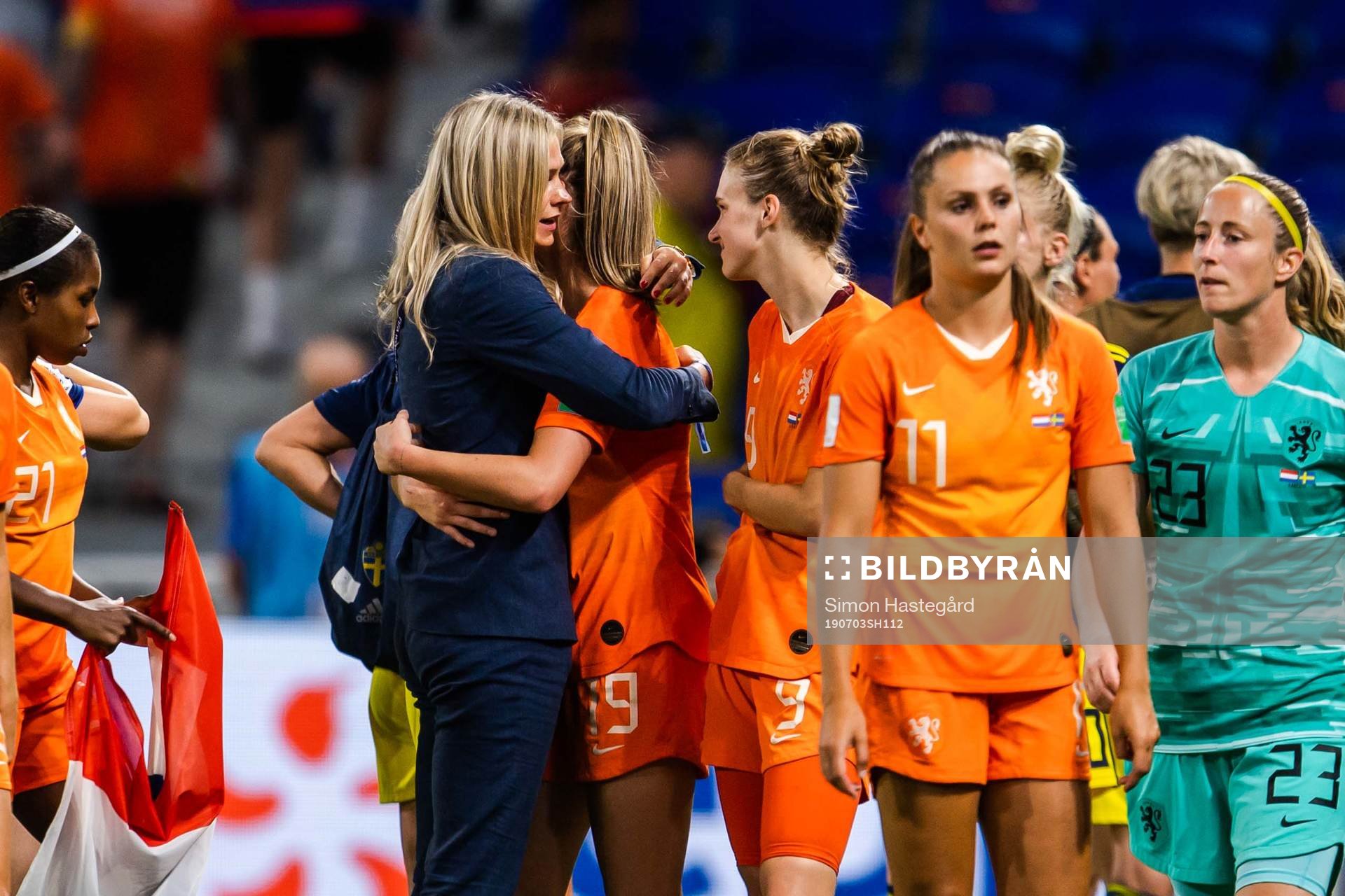 Fridolina Rolfö of Sweden hugs players of of Netherlands