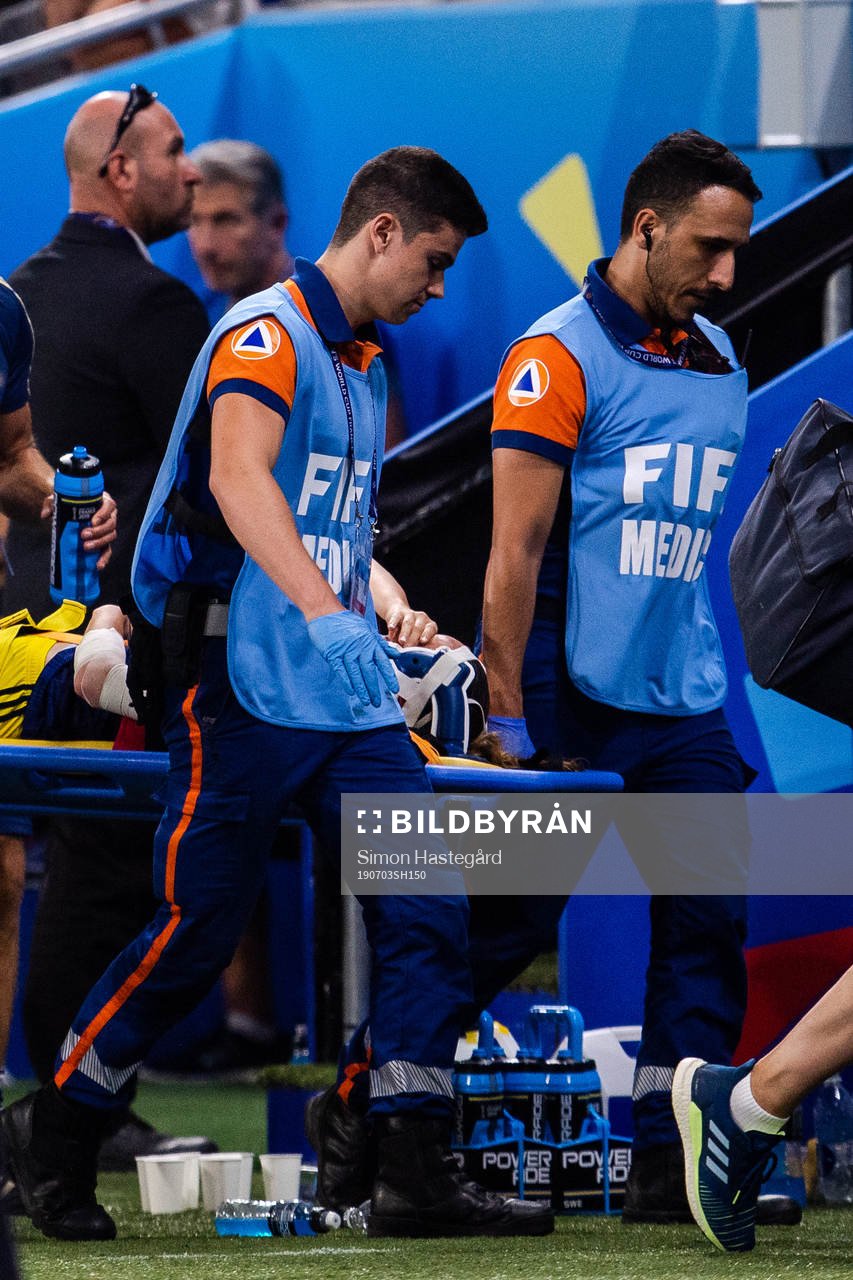 Kosovare Asllani of Swedenis carried off the pitch