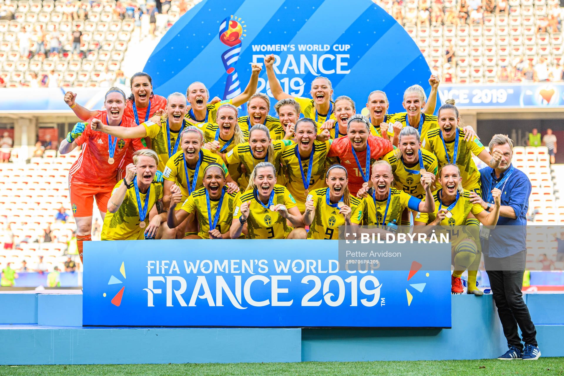 The players of Sweden celebrate with their bronze medals