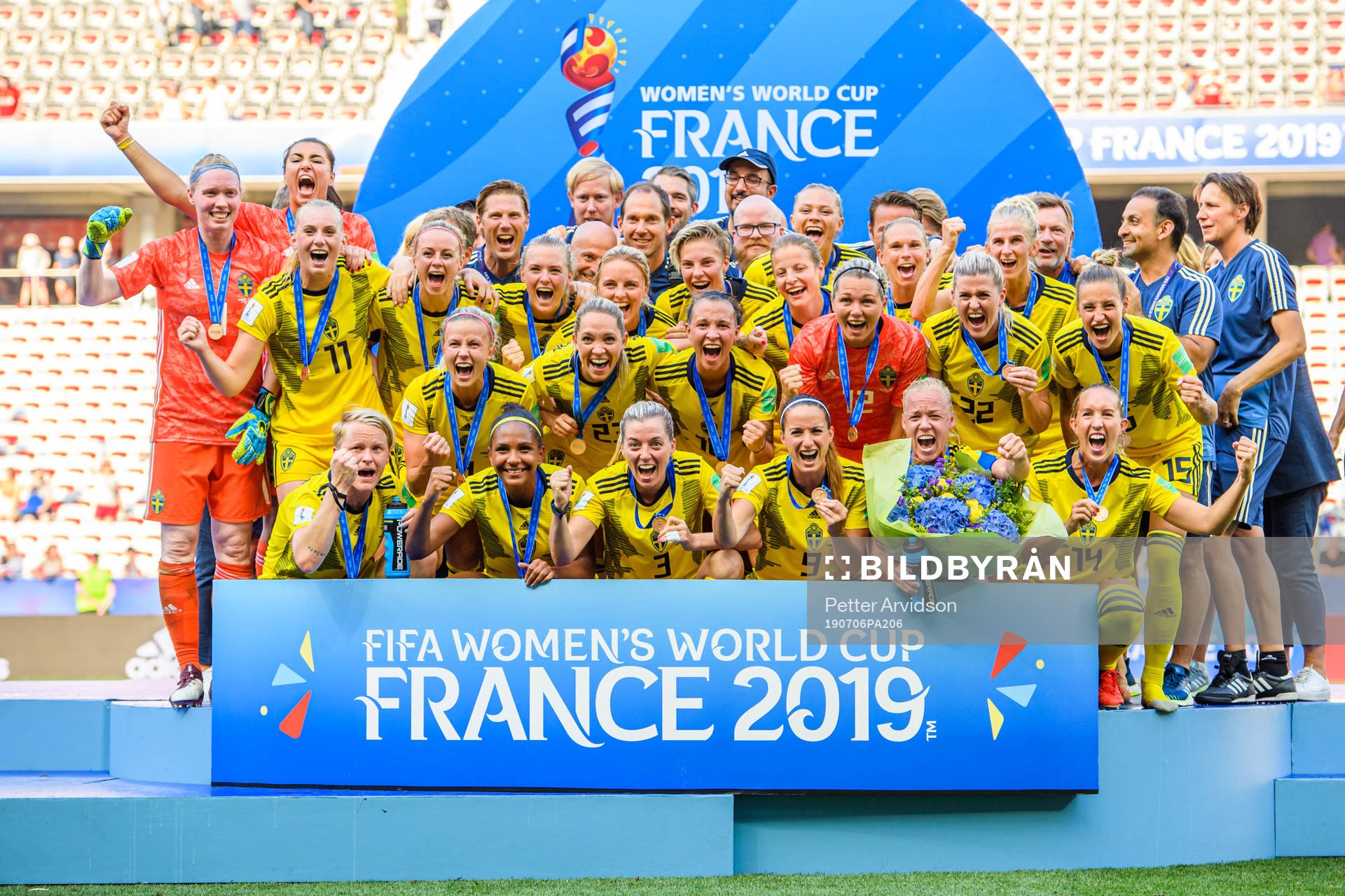The players of Sweden celebrate with their bronze medals