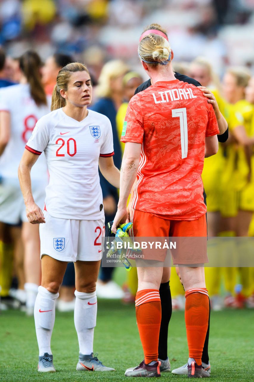 Karen Carney of England and goalkeeper Hedvig Lindahl of