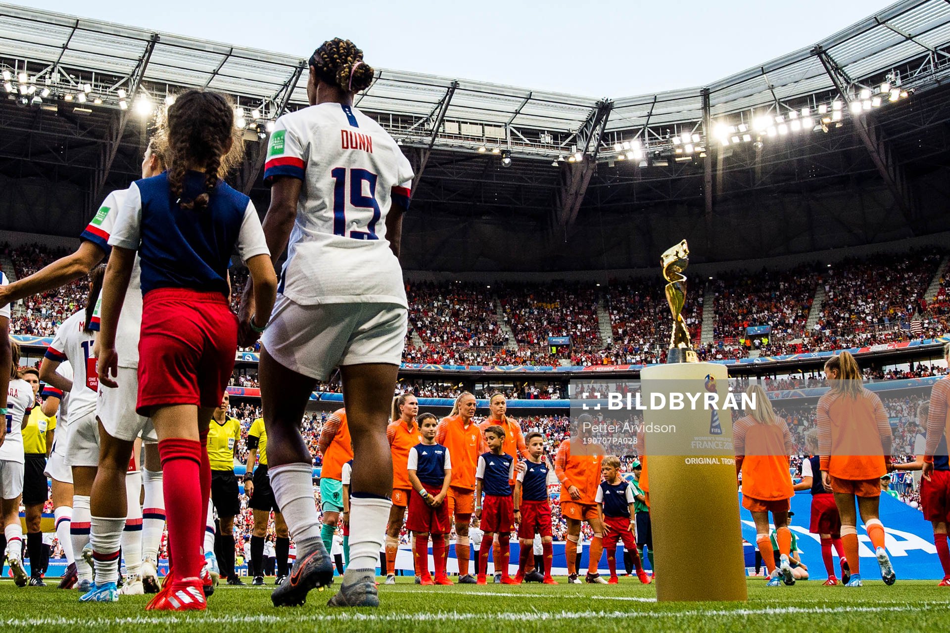 Crystal Dunn of USA next to the trophy