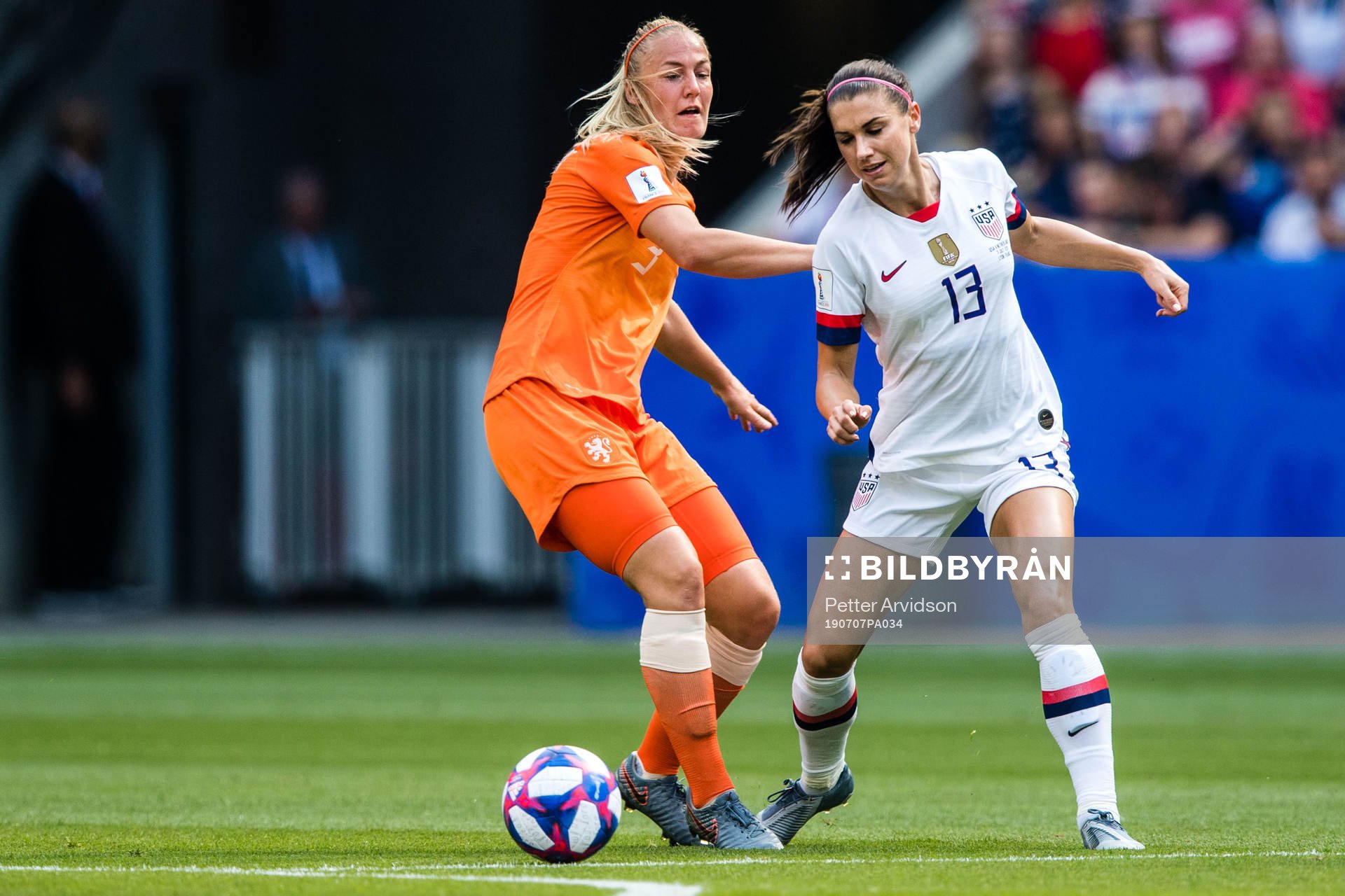 Stefanie Van Der Gragt of Netherlands and Alex Morgan of USA