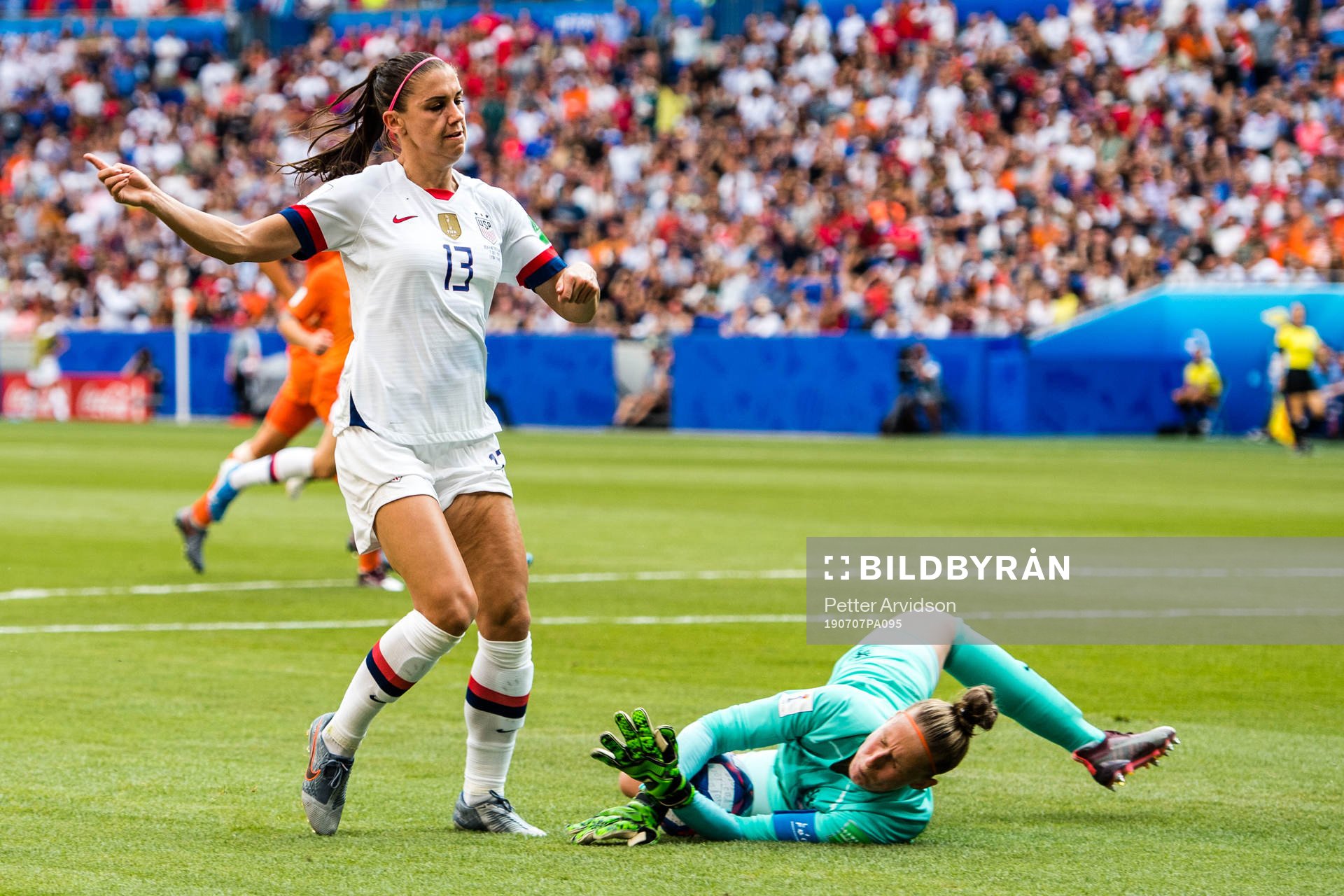 Alex Morgan of USA and goalkeeper Sari Van Veenendaal of
