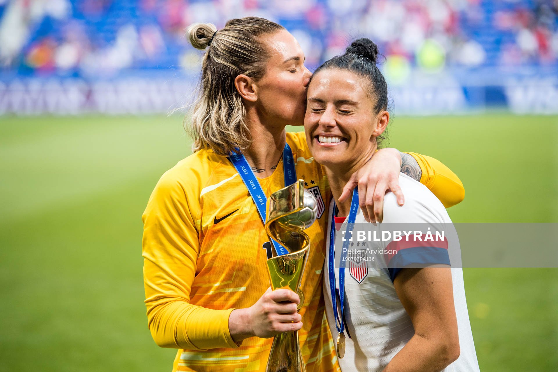 Ashlyn Harris and Tobin Heath of USA celebrates winning the