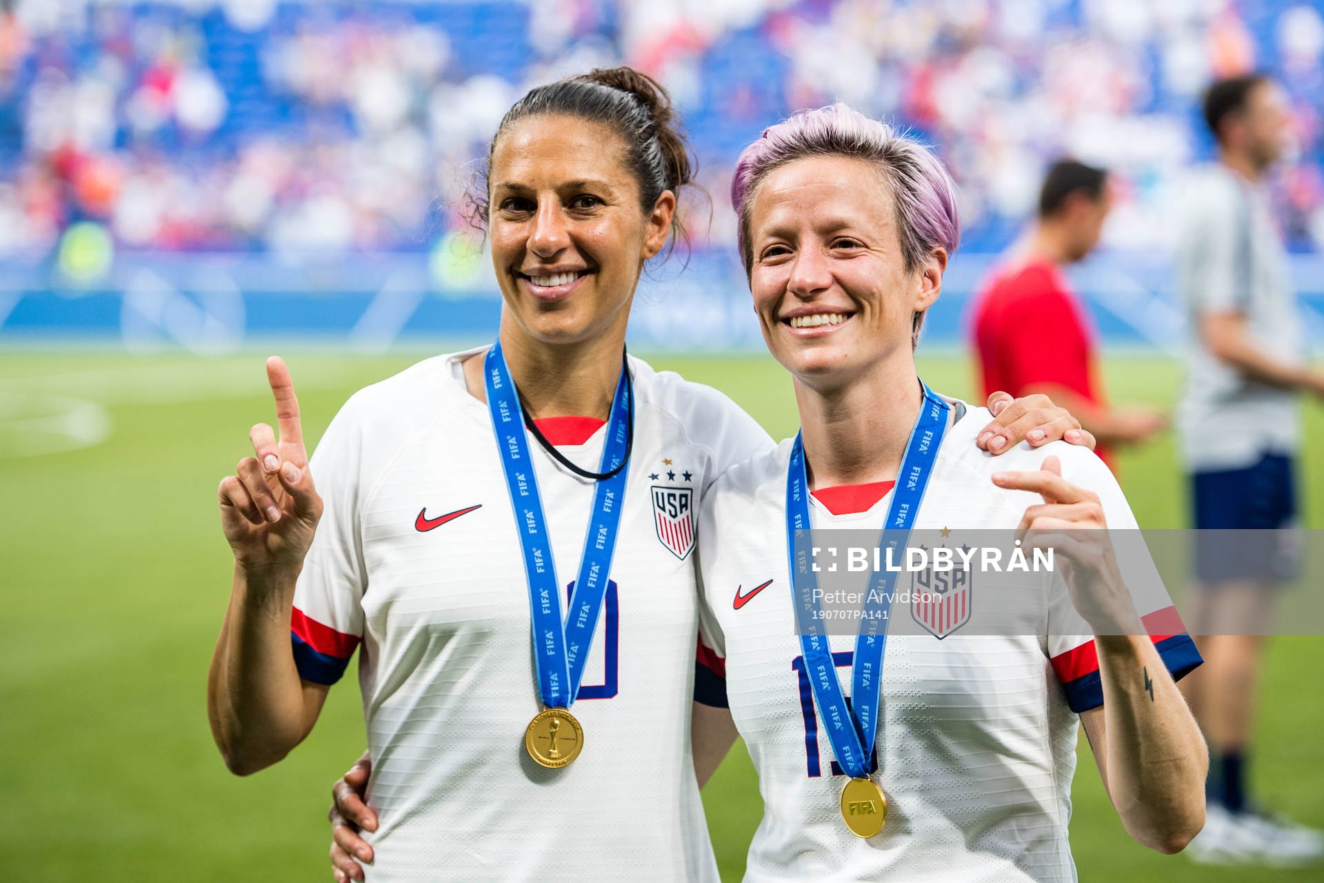 Carli Lloyd  and Megan Rapinoe of USA celebrates winning