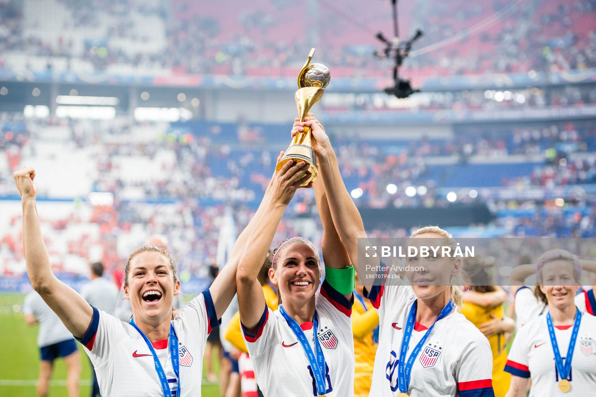 Kelley O'Hara, Ashlyn Harris and Alexandra Long of USA