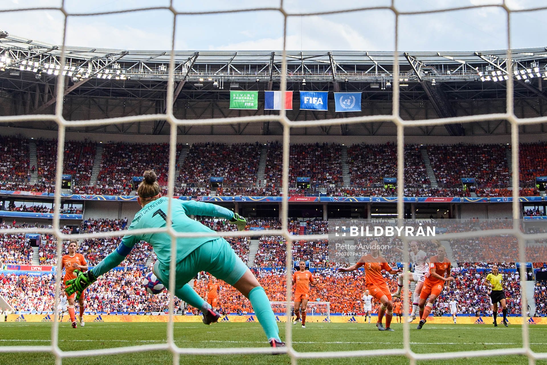 Rose Lavelle of USA scores the 2-0 goal against goalkeeper
