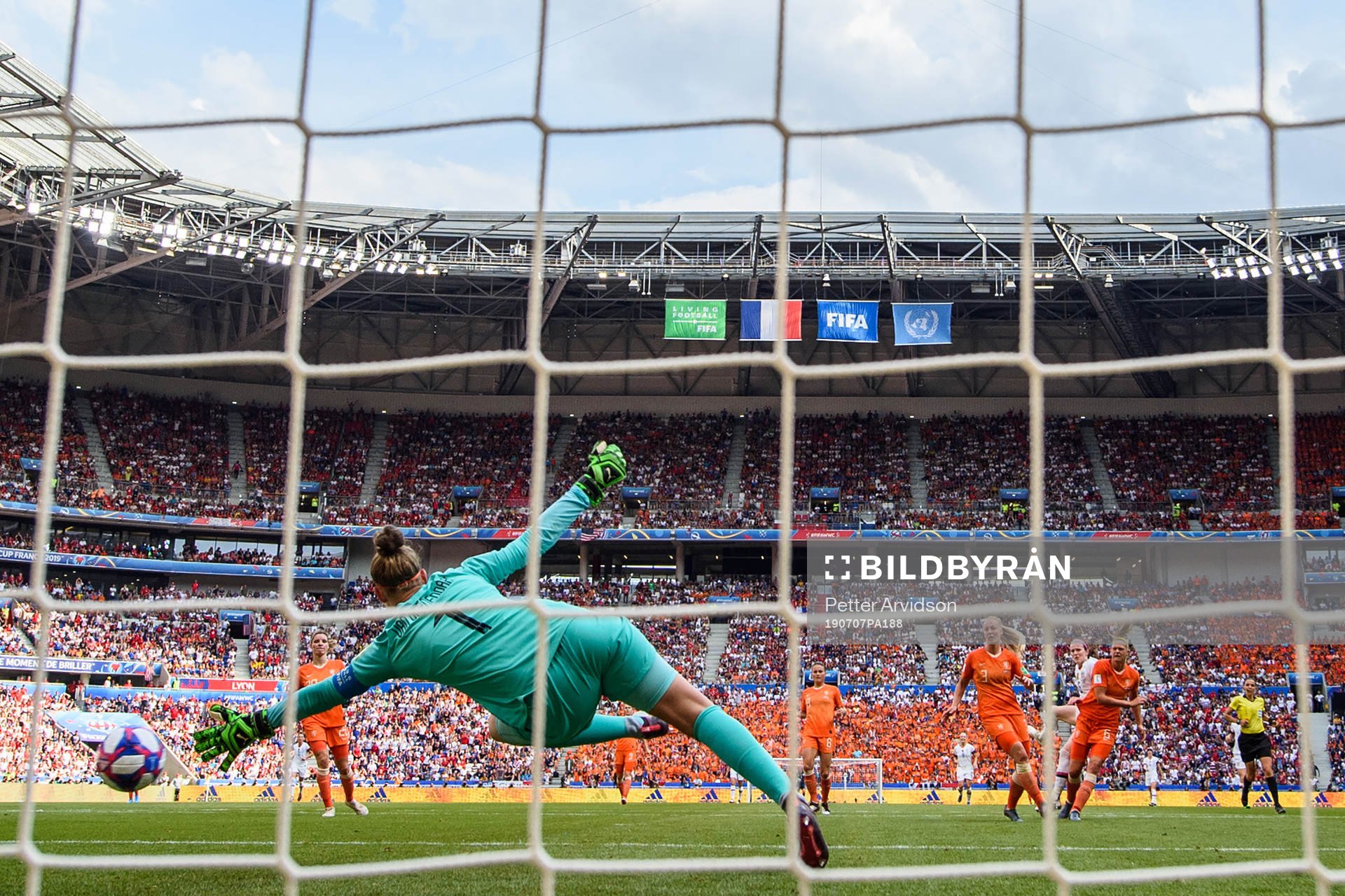 Rose Lavelle of USA scores the 2-0 goal against goalkeeper