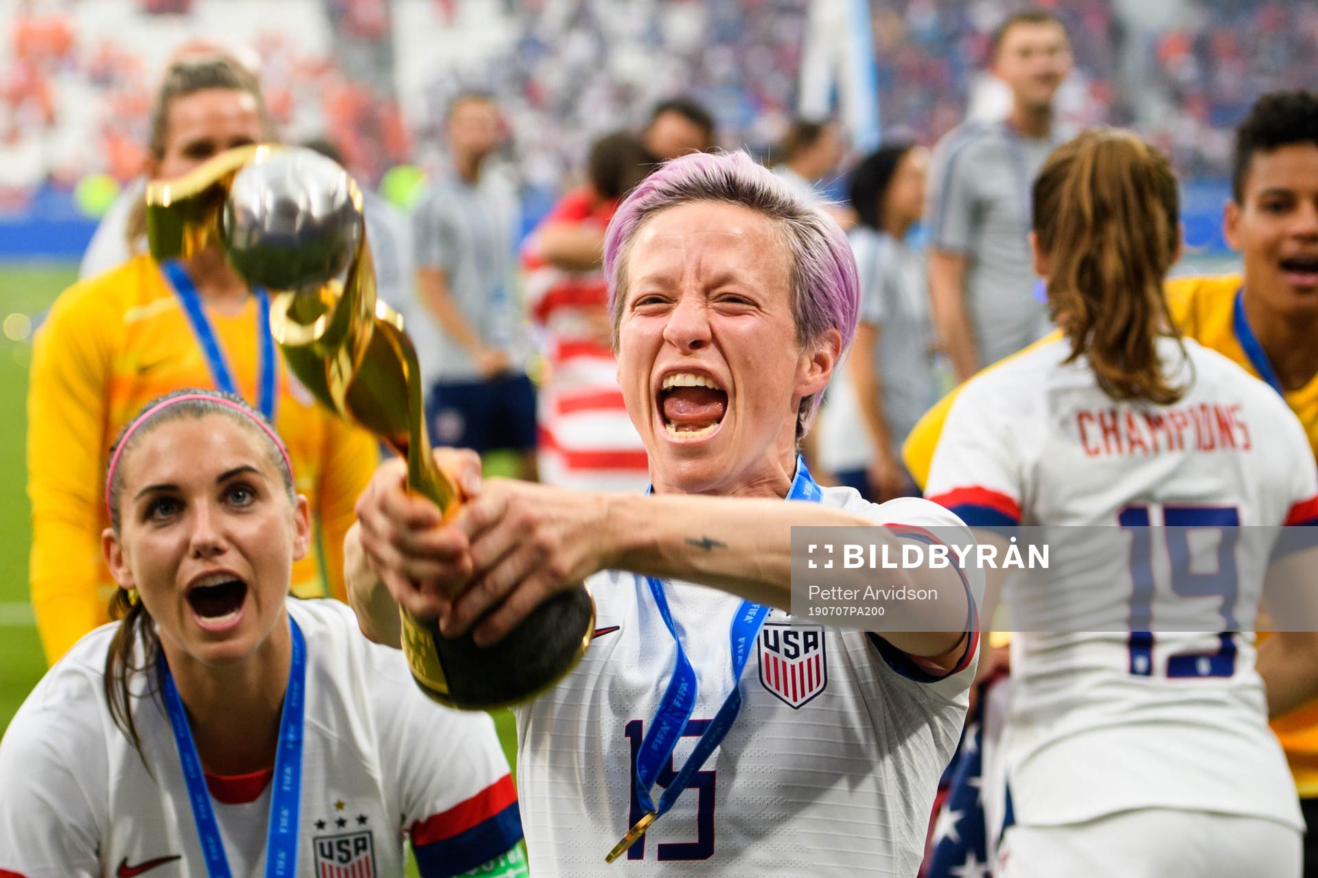 Megan Rapinoe of USA celebrates with the trophy