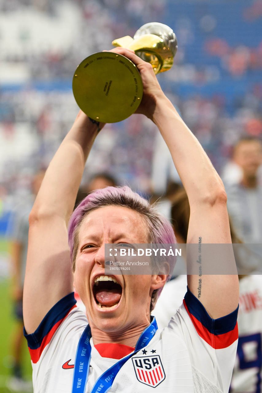Megan Rapinoe of USA celebrates with the trophy