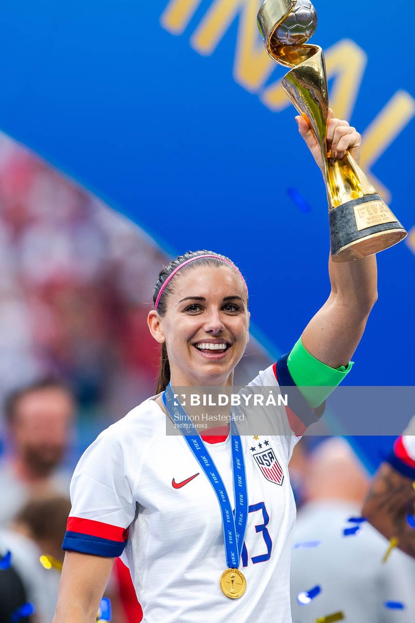 Alex Morgan of USA celebrates with the trophy