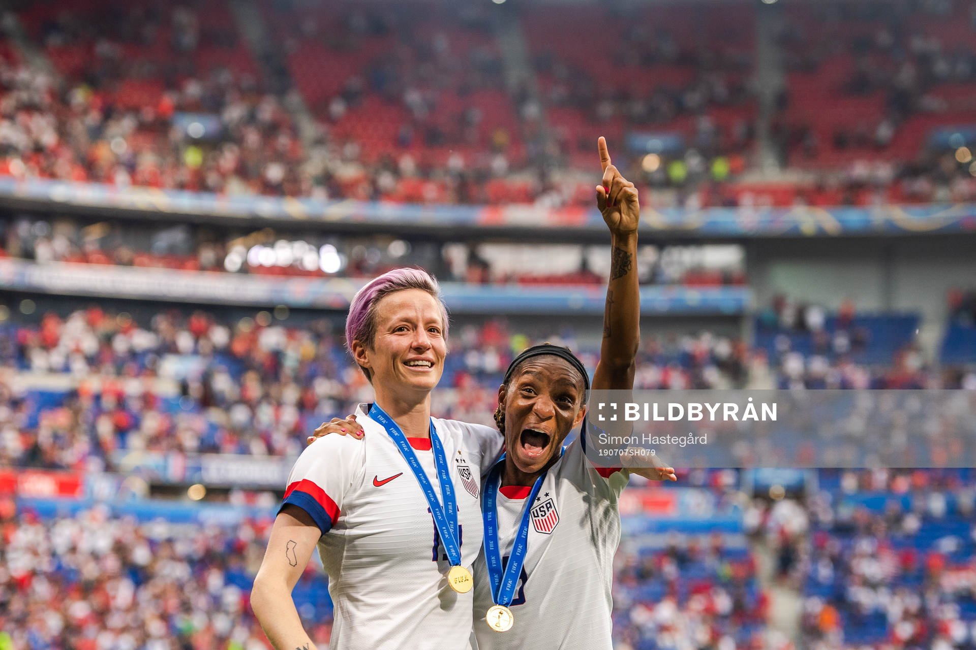 Megan Rapinoe and Crystal Dunn of USA celebrate