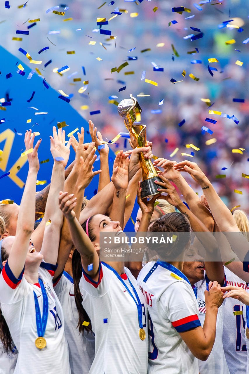 Alex Morgan of USA celebrates with the trophy