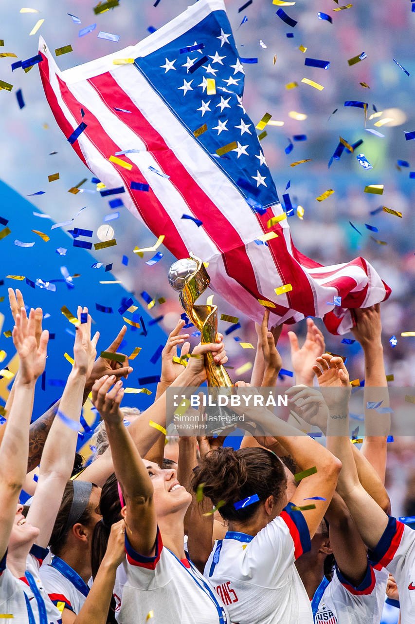 Alex Morgan of USA celebrates with the trophy