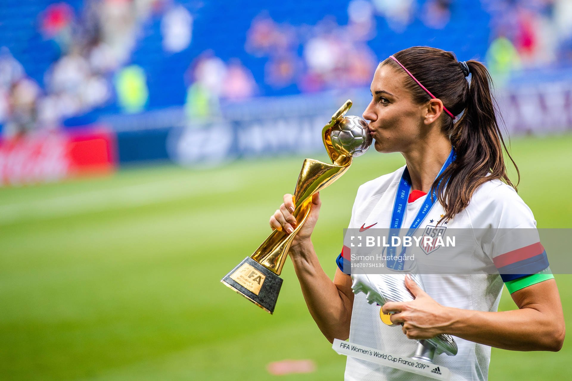 Alex Morgan of USA celebrates with the trophy