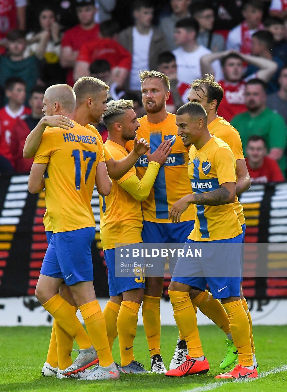 Kasper Larsen,centre, of IFK Norrköping is congratulated