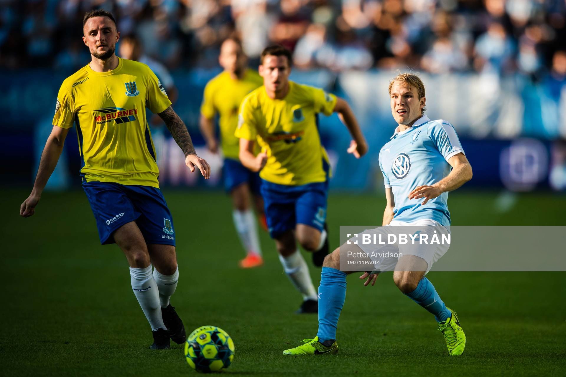 Jude Winchester of Ballymena United and Oscar Lewicki of