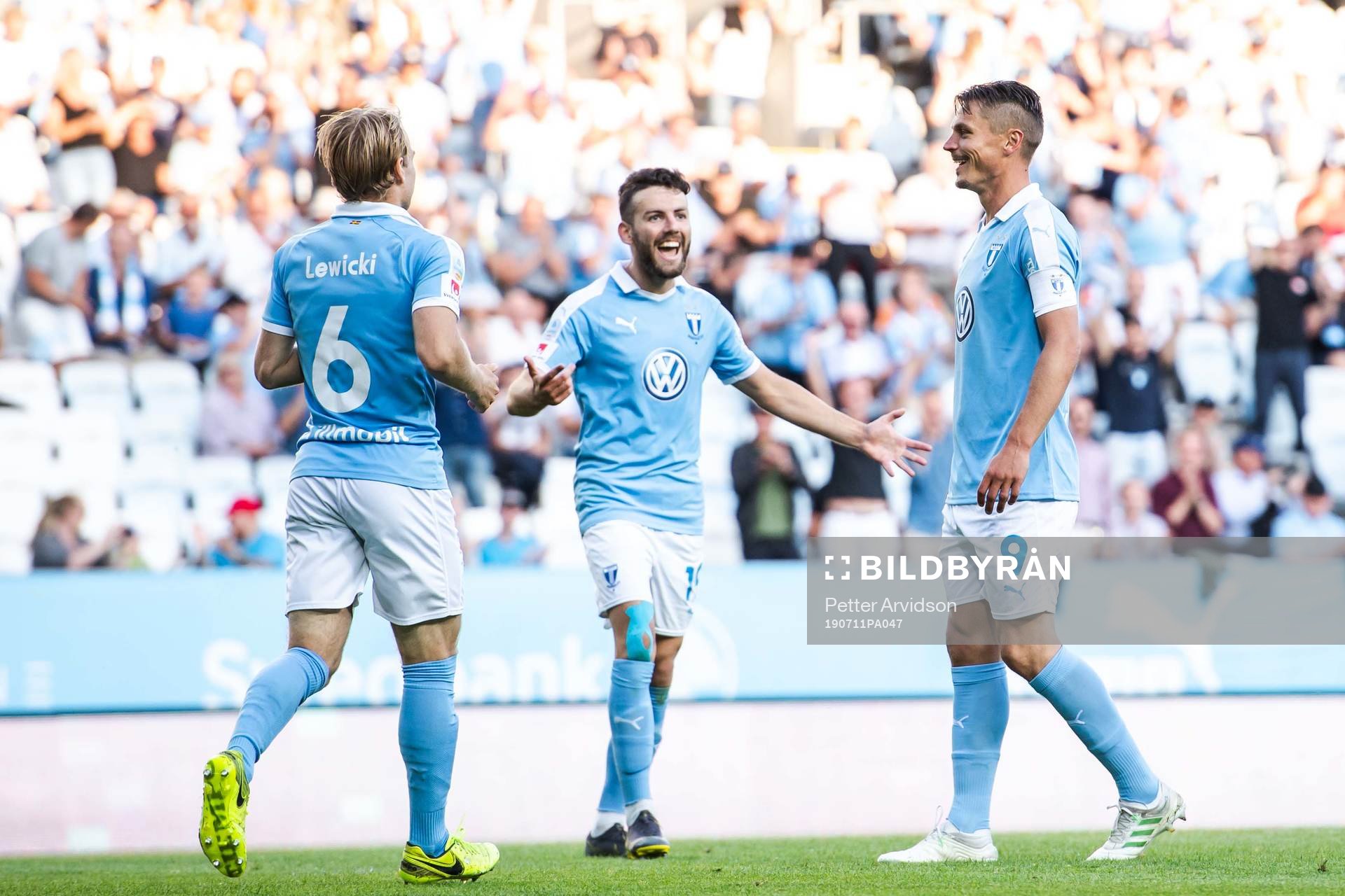Oscar Lewicki and Erdal Rakip celebrate with Markus