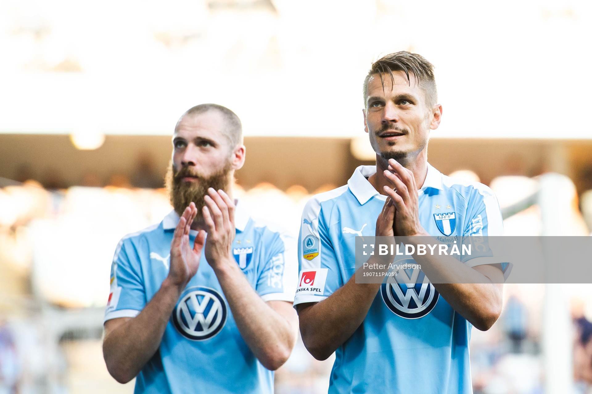 Jo Inge Berget and Markus Rosenberg of Malmö FF thank the