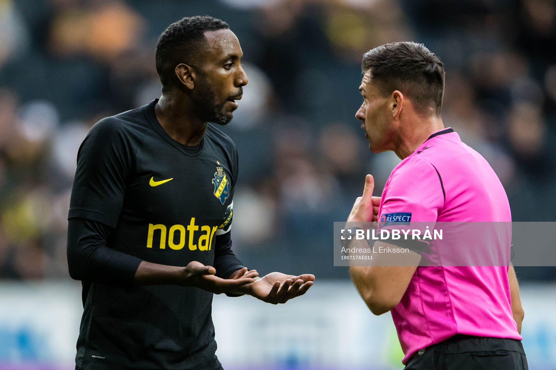 Henok Goitom  of AIK and referee Robert Hennessy