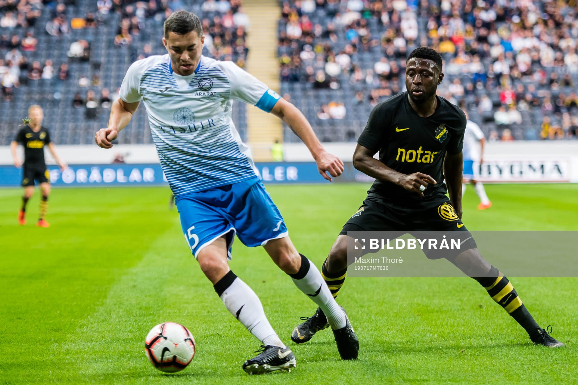 Dmitri Guz of Ararat-Armenia and Chinedu Obasi of AIK