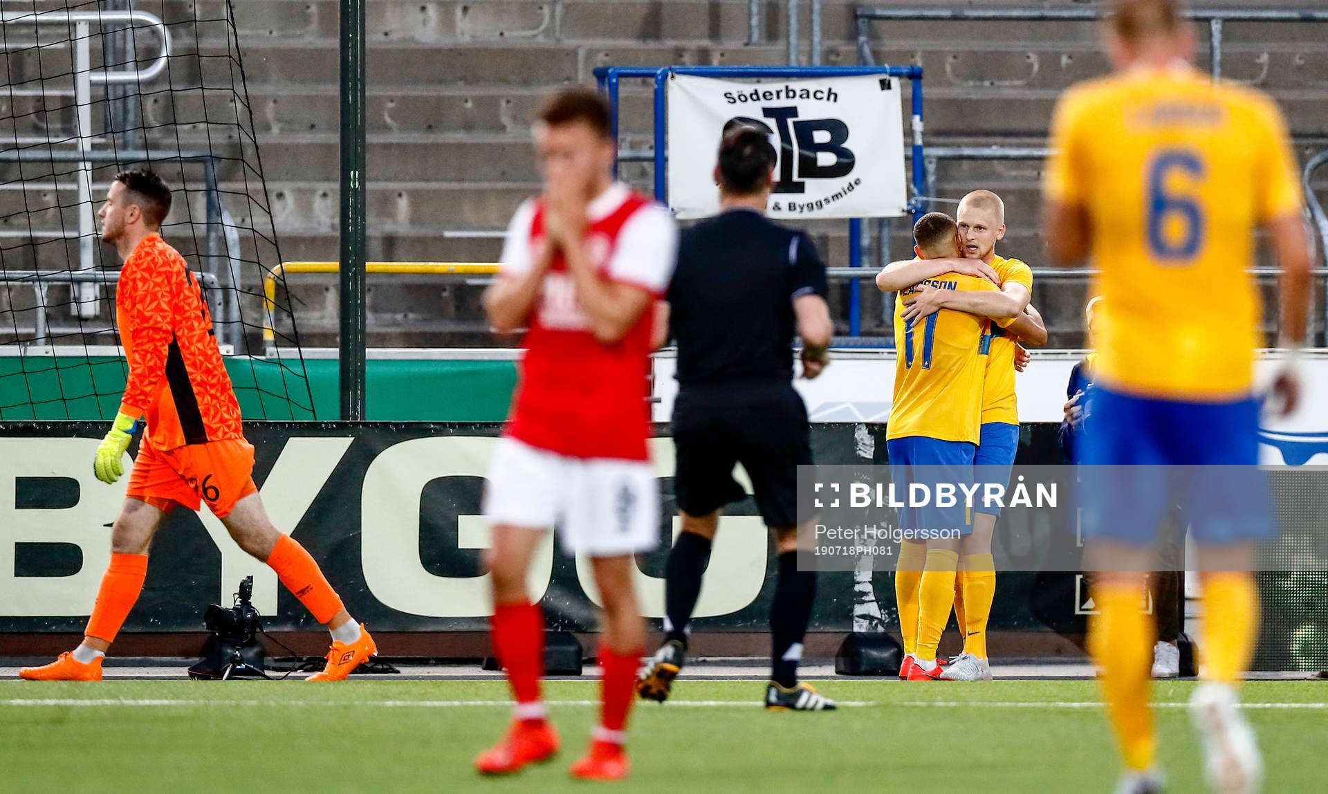 of St Patrick's players look dejected and Kalle Holmberg of