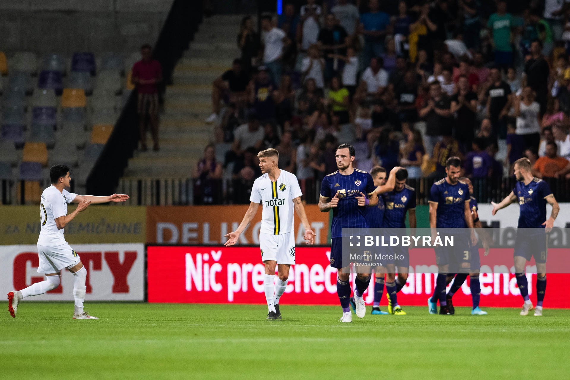 Tarik Elyounoussi of AIK reacts while players of Maribor