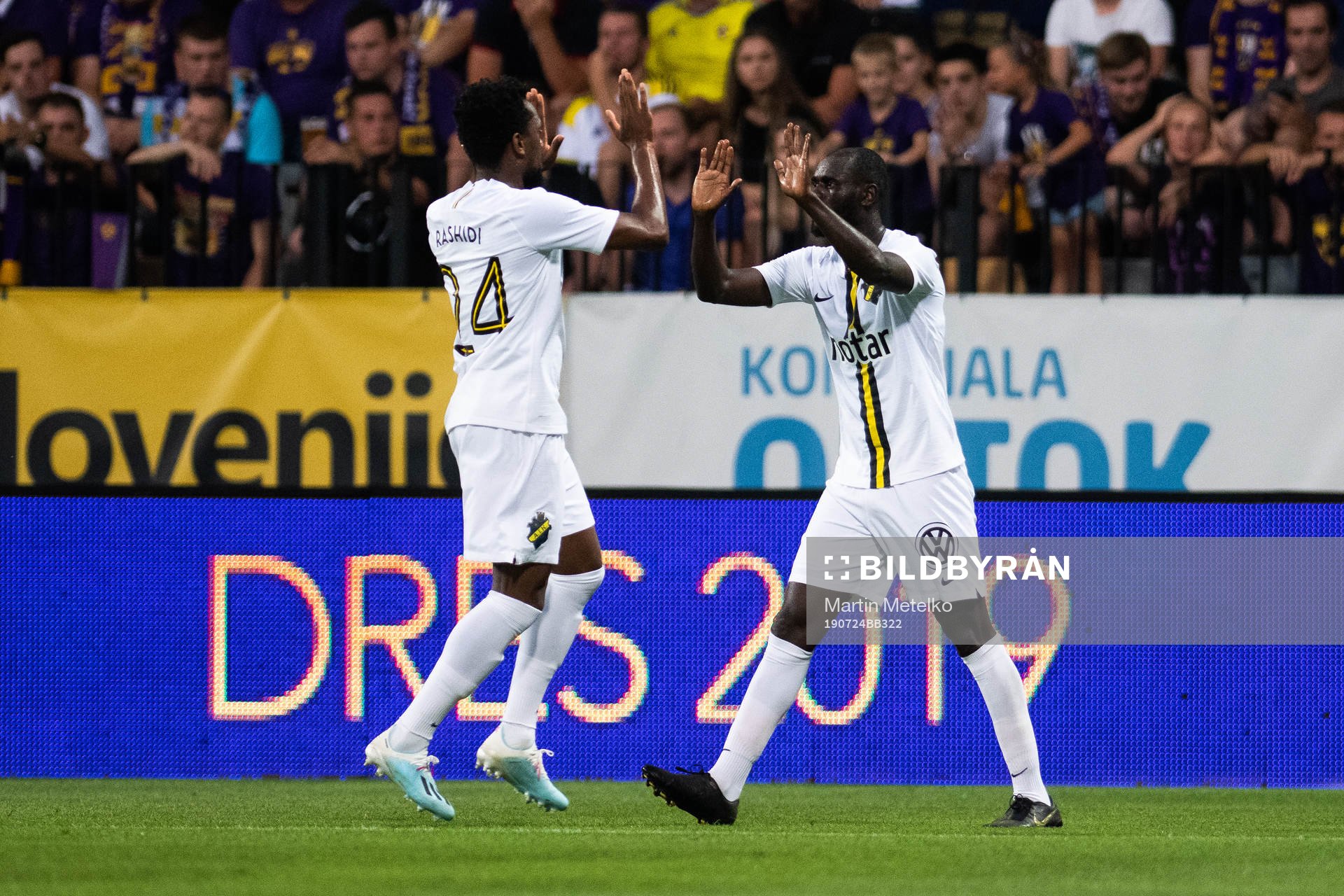 Heradi Rashidi and Enoch Kofi Adu celebrate after Henok Goitom (not pictured) scored 1-1 during the UEFA Champions League qualifying match between Maribor and AIK on July 24, 2019 in Maribor.