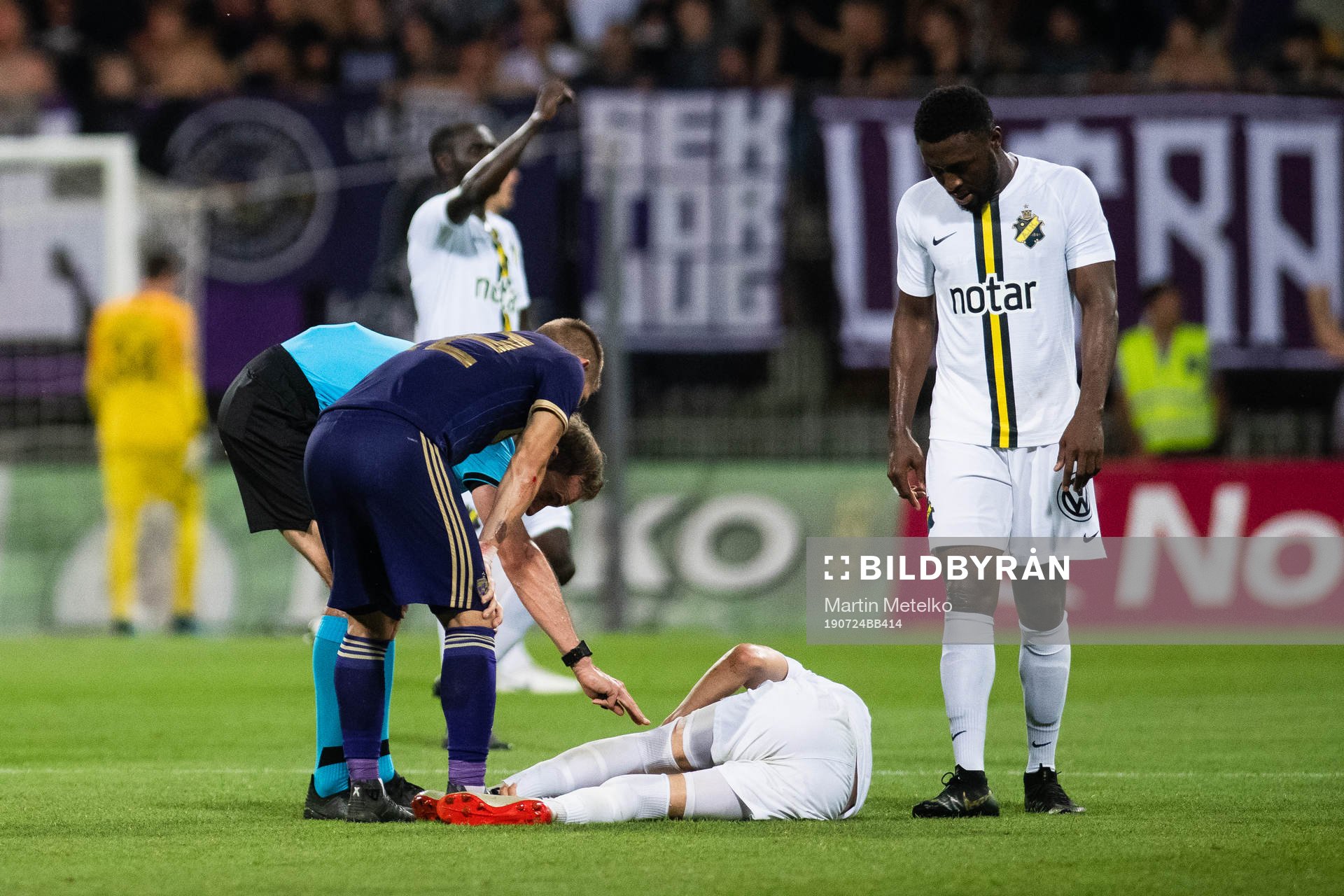 Referee Sascha Stegemann and a player of Maribor attends to