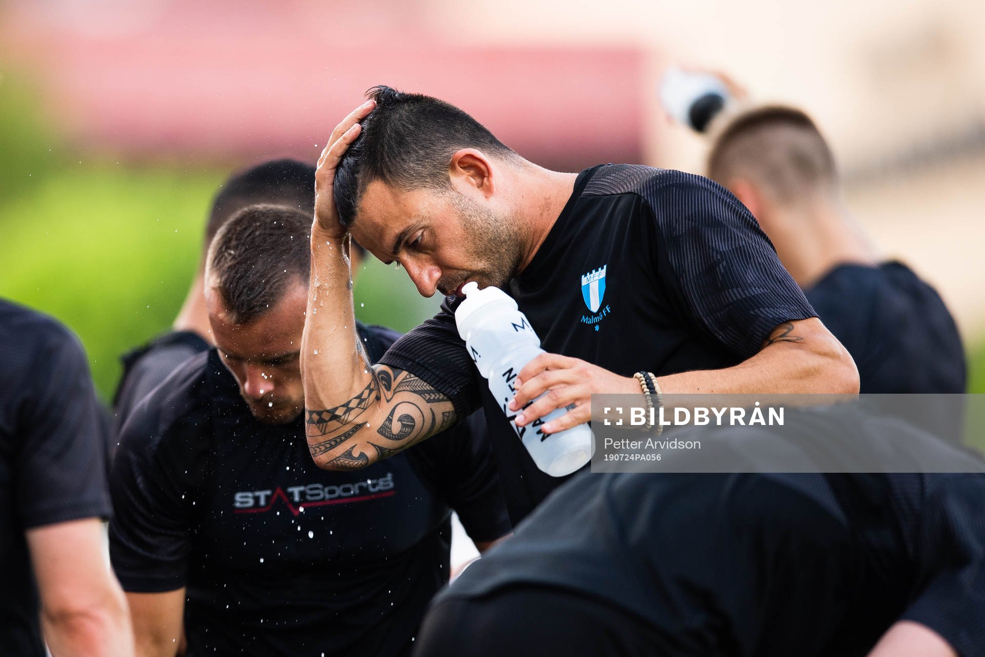 Behrang Safari of Malmö FF with water dripping from his