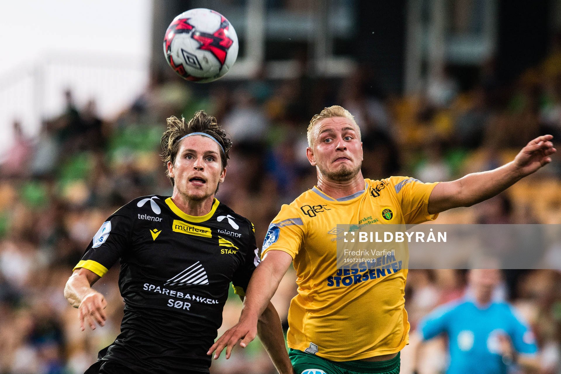Kasper Skaanes of Start and Espen Bjørnsen Garnås of Ull/Kisa during the OBOS-ligaen match between Ull/Kisa and Start on July 28, 2019 in Jessheim.
