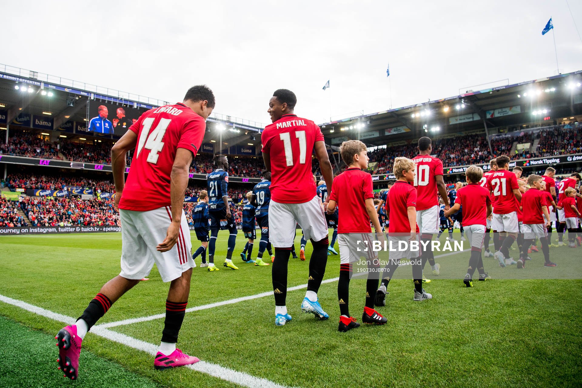 Jesse Lingard and Anthony Martial of Manchester United enter the pitch ahead of the friendly match between Kristiansund and Manchester United on July 30, 2019 in Oslo.