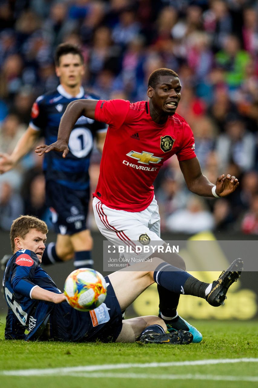 Meinhard Olsen of Kristiansund and Paul Pogba of Manchester