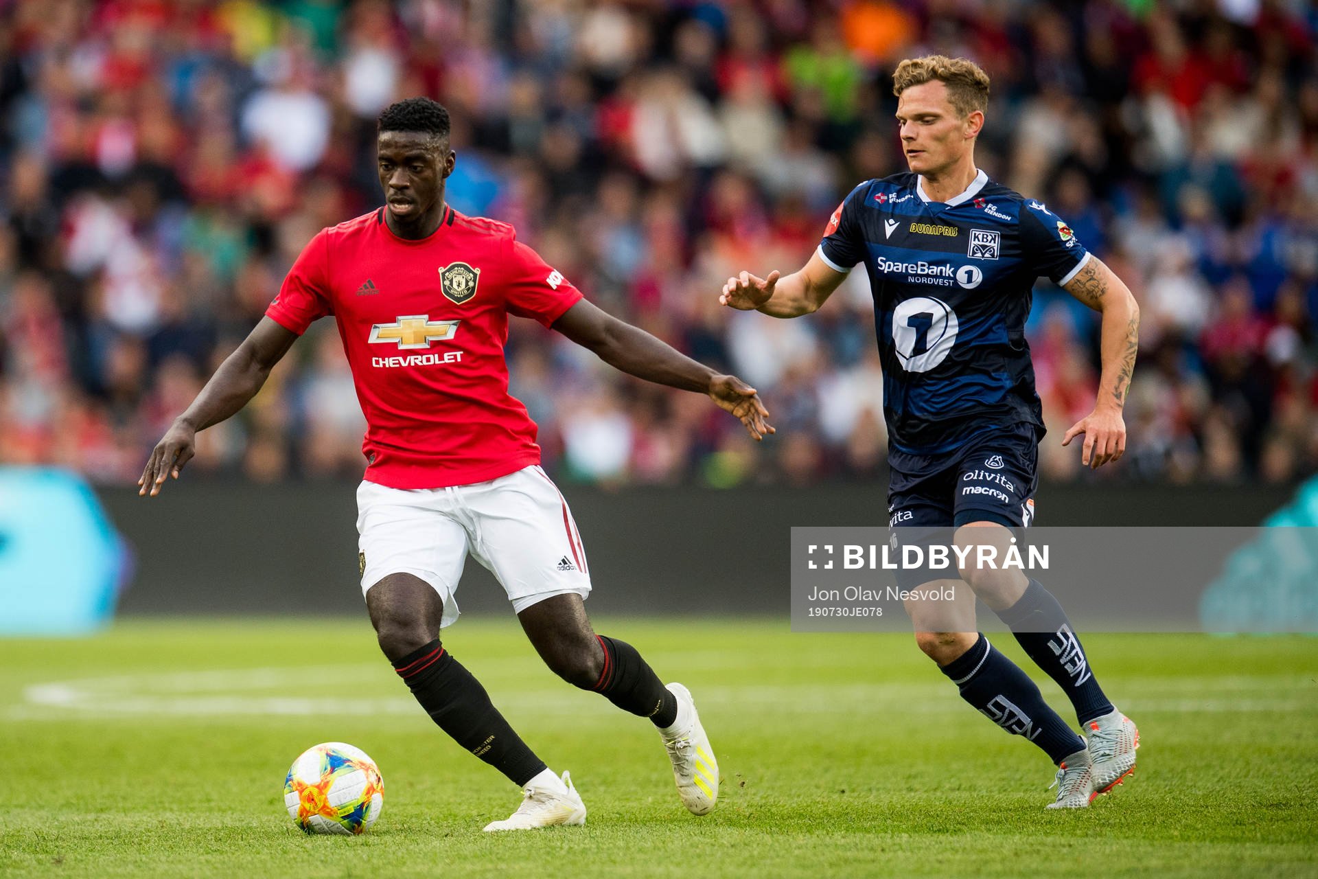 Axel Tuanzebe of Manchester United and Meinhard Olsen of