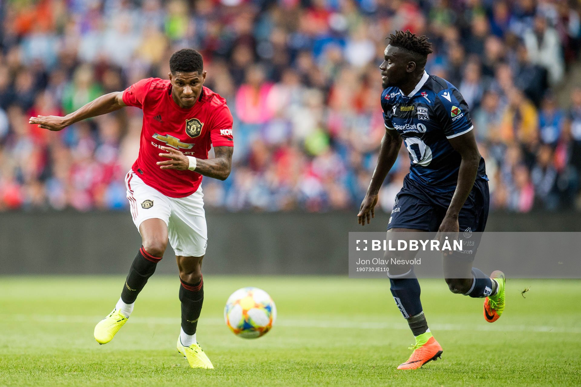 Marcus Rashford of Manchester United and Aliou Coly of