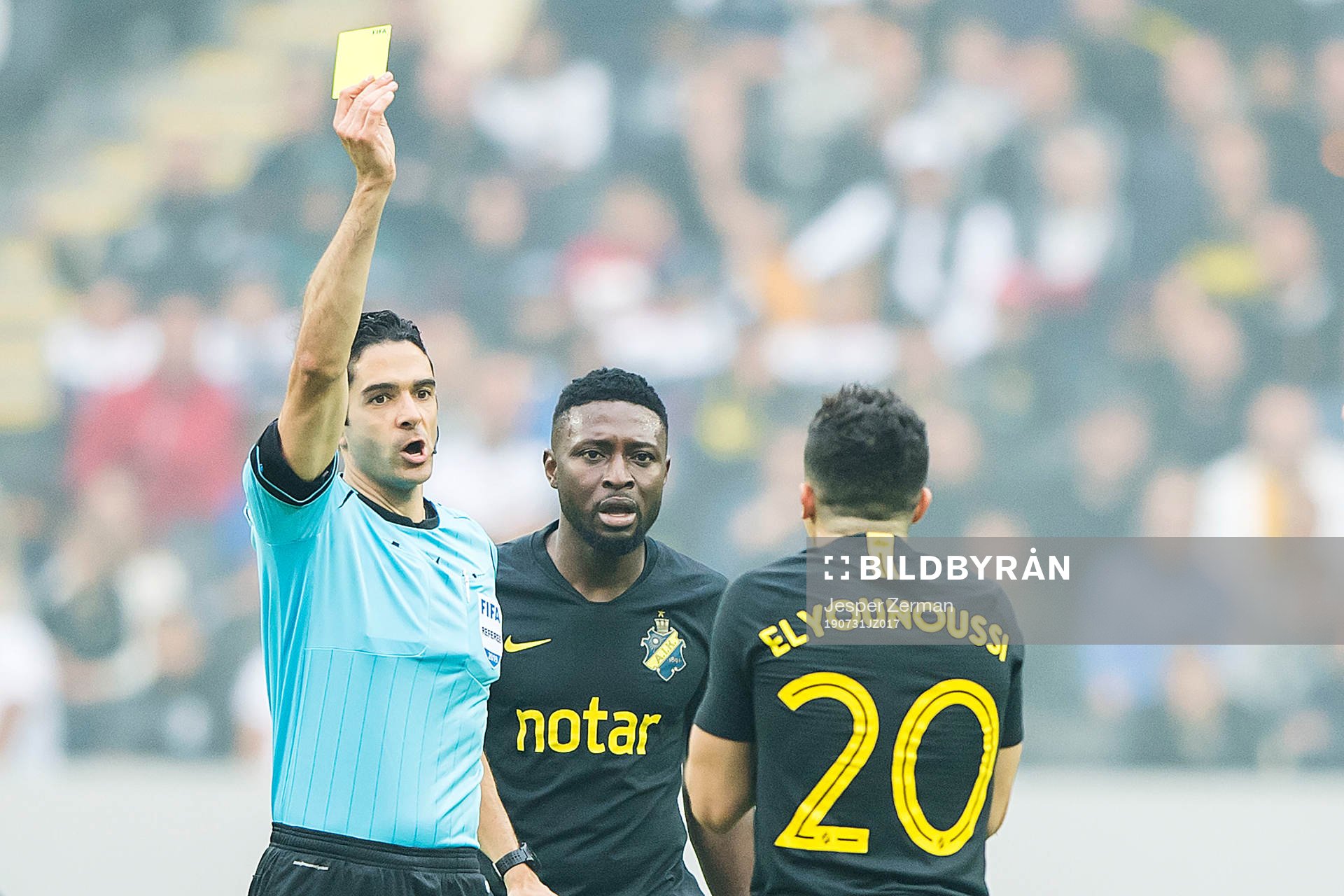 Tarik Elyounoussi of AIK gets a yellow card
