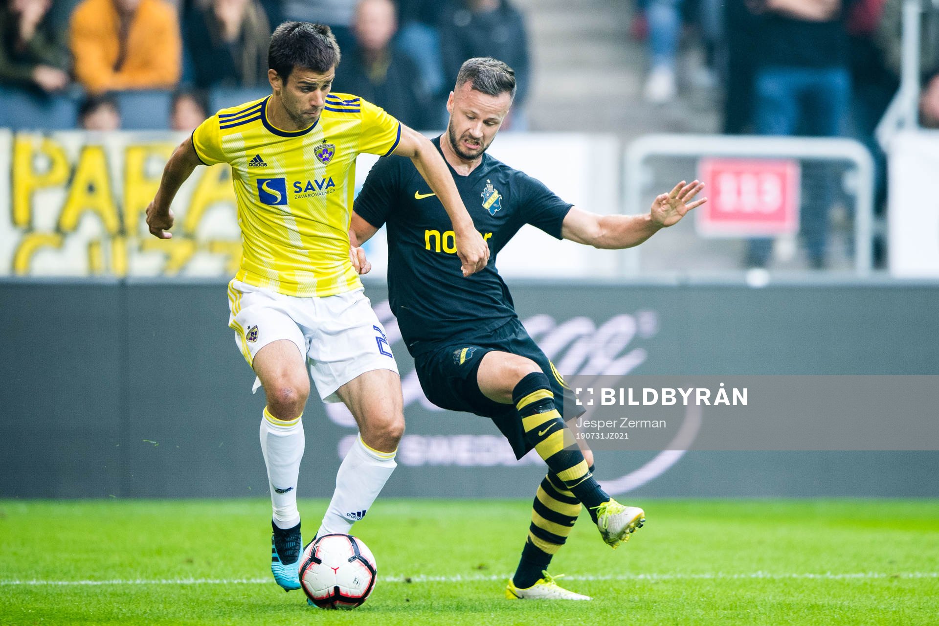Mitja Viler of Maribor and Robert Lundström of AIK during the UEFA Champions League qualifying match between AIK and Maribor on July 31, 2019 in Stockholm.