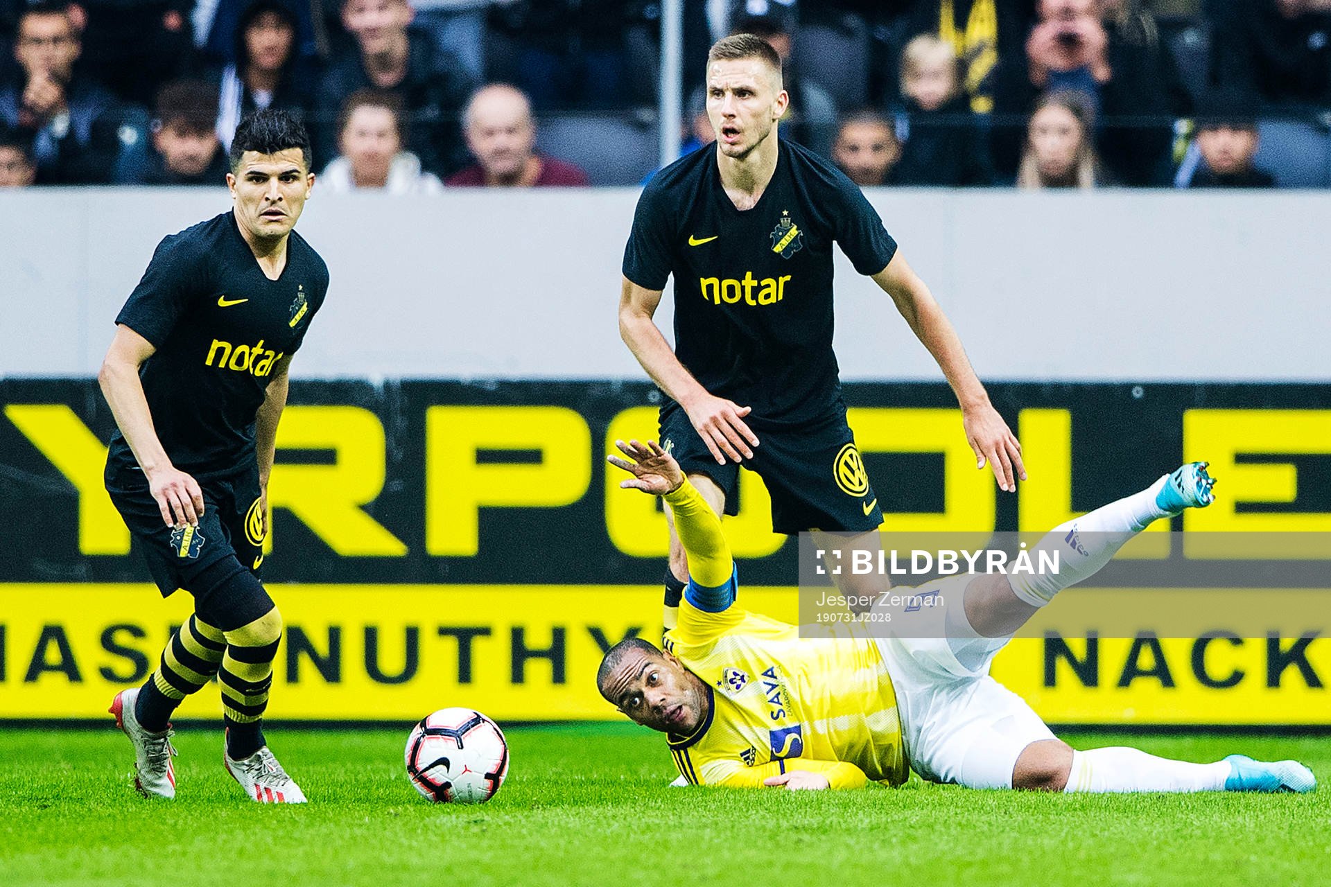 Karol Mets and Tarik Elyounoussi of AIK and Marcos Tavares of Maribor during the UEFA Champions League qualifying match between AIK and Maribor on July 31, 2019 in Stockholm.