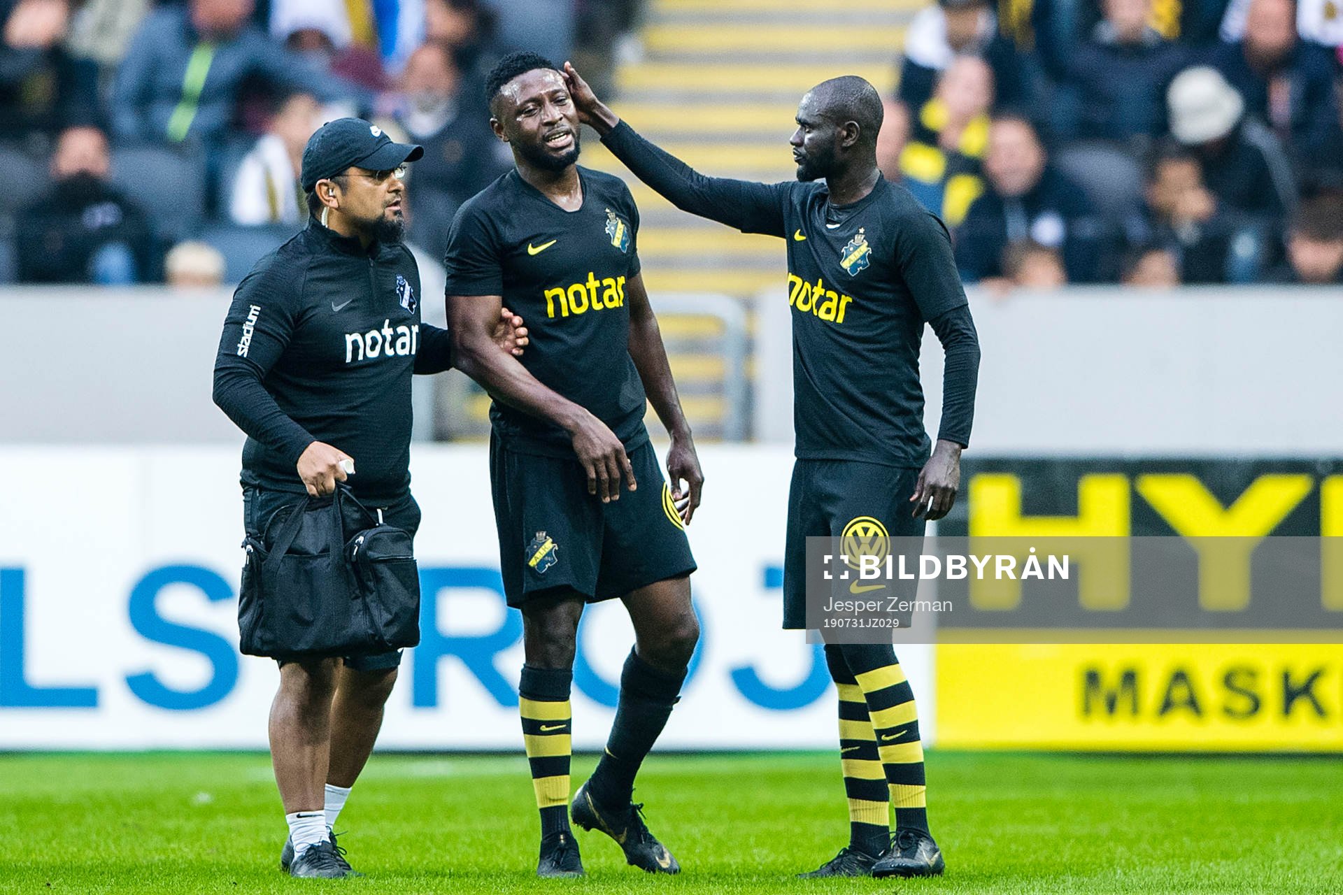 Chinedu Obasi of AIK leaves the pitch with an injury