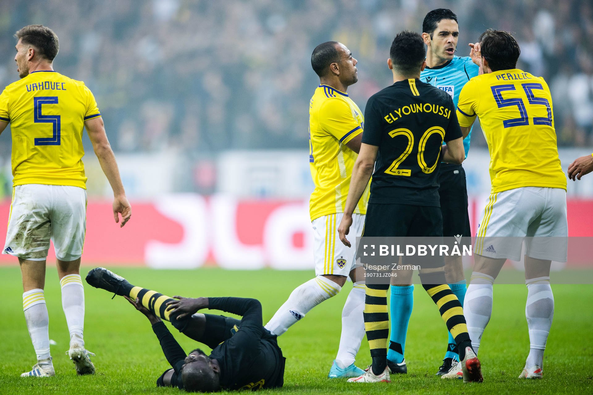 Enoch Kofi Adu of AIK on the ground and Marcos Tavares and Spiro Pericic protest against the referee during the UEFA Champions League qualifying match between AIK and Maribor on July 31, 2019 in Stockholm.