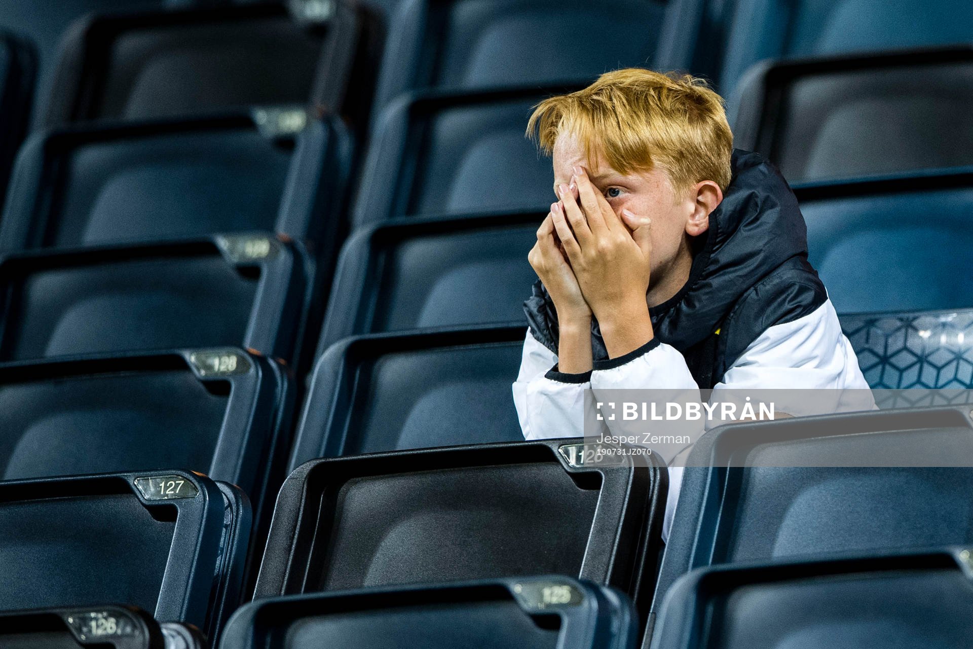 Fans of AIK looks dejected in the stands